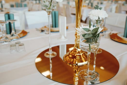 Wedding table with favors and flowers. Elegance wedding decor.