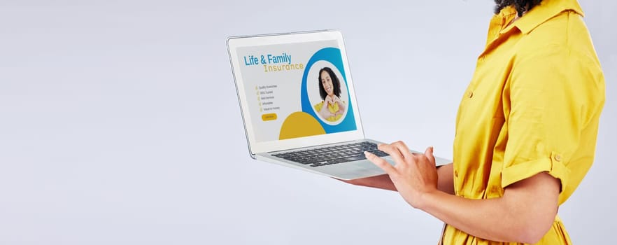 Laptop, insurance and security with a customer in studio on a gray background for life cover sign up. Computer, website and mockup with a female person searching for information about protection.