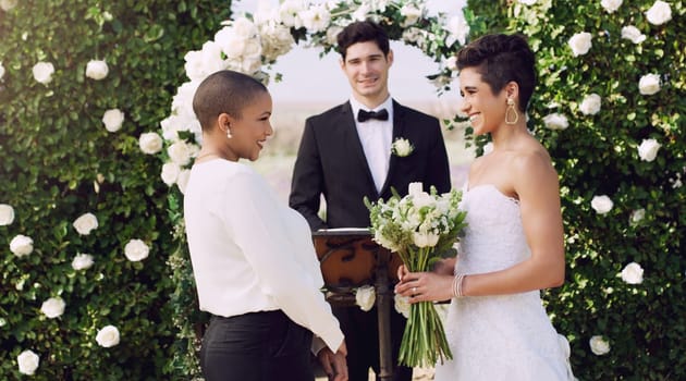 Love, marriage and lgbtq with lesbian couple at wedding for celebration, happy and bride pride. Smile, spring and ceremony with women at event for partner commitment, queer romance and freedom.