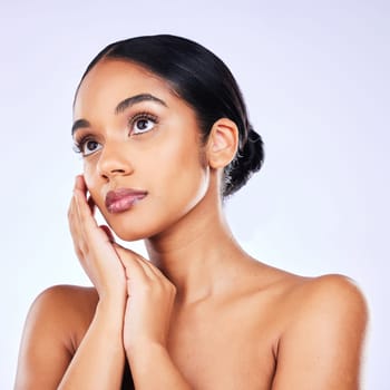 Thinking, glow and woman with skincare, dermatology or self care against a white studio background. Female person, wellness or model with cosmetics, bare or ideas with aesthetic, decision or wellness.