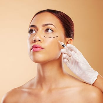 Ophthalmic, plastic surgery and face of woman with beauty facial for isolated in brown studio background. Skincare, cosmetics and young person with syringe for treatment or medical transformation.