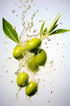 Green olives with splashes of water on a light background. Levitation. High quality photo