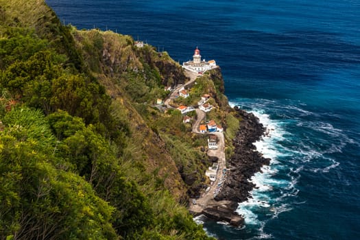 A panoramic view of the Nordeste lighthouse directly on the cliffs of the Azores island of Sao Miguel, Portugal