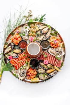 Fresh seafood plate with, mussels, oysters, scallop, salmon and tuna