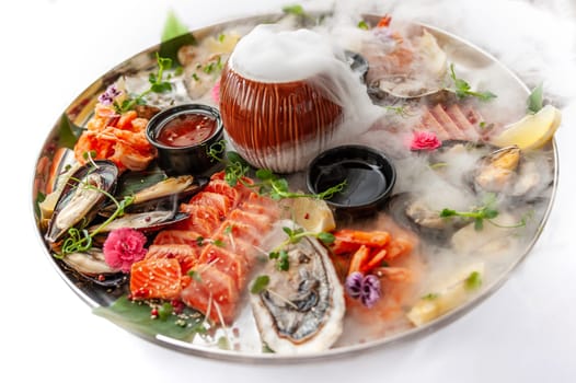 Fresh seafood plate with, mussels, oysters, scallop, salmon and tuna