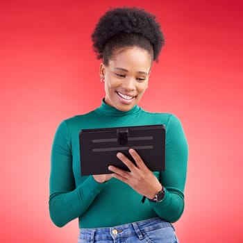 Happy woman, tablet and research for social media or communication against a red studio background. African female person on technology for online browsing, networking or streaming entertainment.