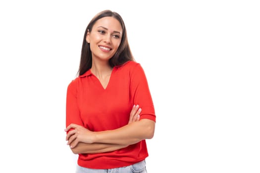 close-up portrait of a cute young european brunette lady in a red t-shirt on the background with copy space.