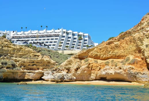 Wild beach under the rocks in the south of the Portuguese region Algarve