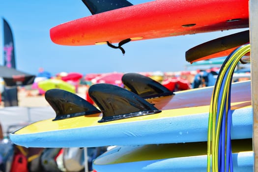 Details of the surfboard on the beach. Set of different color surf boards