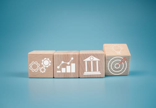 Wood cube block stacking with icon.Concept of business strategy and goal action plan. 