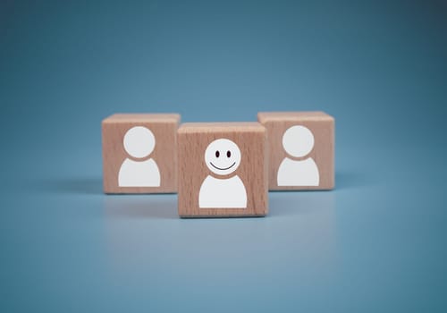 concept Business and HR for leadership and team leader, one wooden dolls stand out in front  Different and stand out from the group