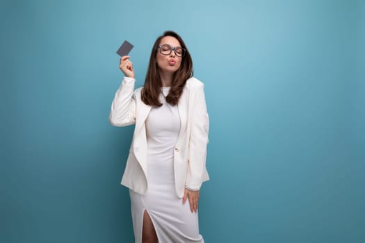 successful young brunette woman with credit card mockup.