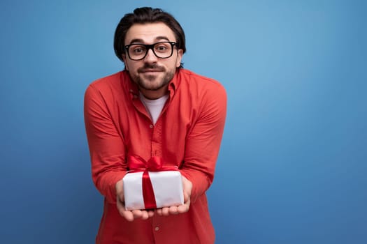 cute happy young brunette man got a lovely birthday present.