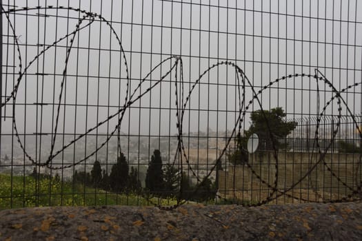 Metal protective wire along the fence. Jerusalem, Israel March 27, 2021. High quality photo