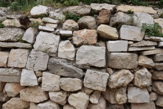 A wall of right-angled white building stones. Jerusalem, Israel 27 March 2021. High quality photo