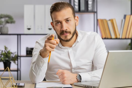 Conflict Quarrel Negotiation. Young angry boss business man making webcam online video call, talking colleague conversation analyzing financial report mistake problem. Guy at office looking at camera