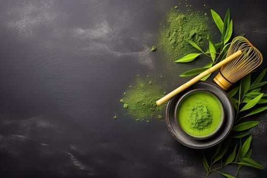 Matcha green tea powder and whisk, on a black background with place for text. High quality photo