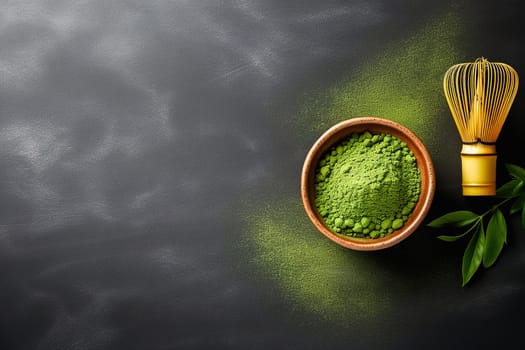 Matcha green tea powder and whisk, on a black background with place for text. High quality photo