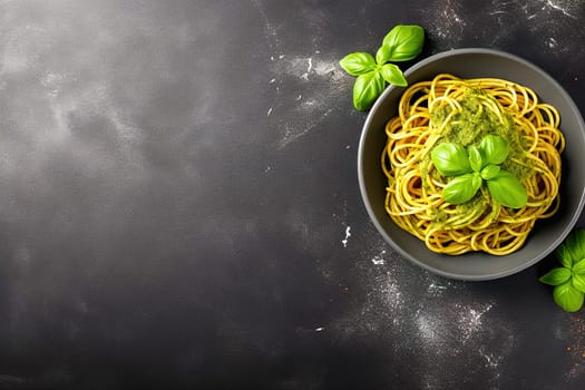 Spaghetti with cheese in a black plate with space to insert text. View from above. High quality photo