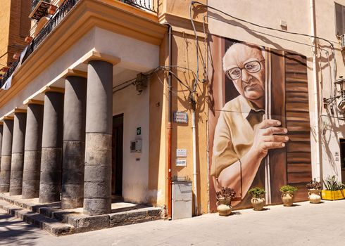 Porto Empedocle, Italy - July 22: View of the Murales tribute to the sicilian writer Andrea Camilleri painted by the street artist Salvo Ligama on July 22, 2021