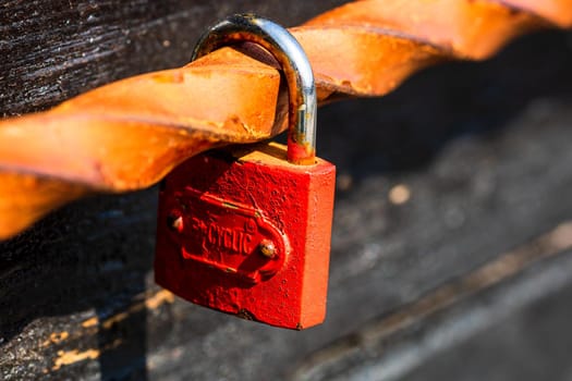 Love symbol, old rusty padlocks hanging on wooden fortress bridge in Alba Iulia, Romania, 2021