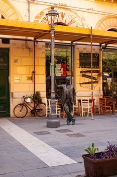 Porto Empedocle, Italy - July 22: The bronze statue of the Sicilian detective Montalbano, character of the television series produced and broadcast by RAI based on the detective novels of Andrea Camilleri on July 22, 2021