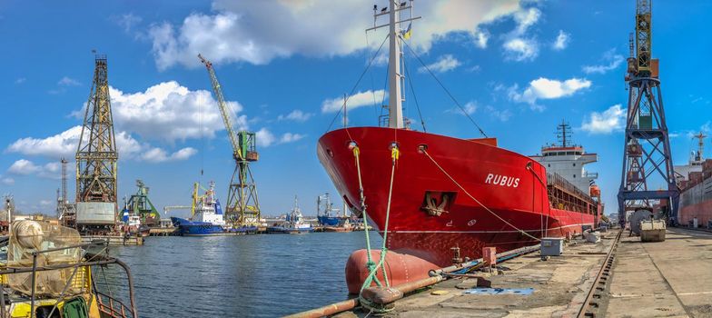 Chernomorsk, Ukraine. 21.03.2021. Big ship at the pier in the Chernomorsk Shipyard on a sunny spring day