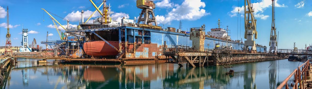 Chernomorsk, Ukraine. 21.03.2021. Large ship in dry dock of the Chernomorsk Shipyard on a sunny spring day