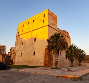 View of the Fortress also called Tower of Charles V at sunset in Porto Empedocle. Sicily