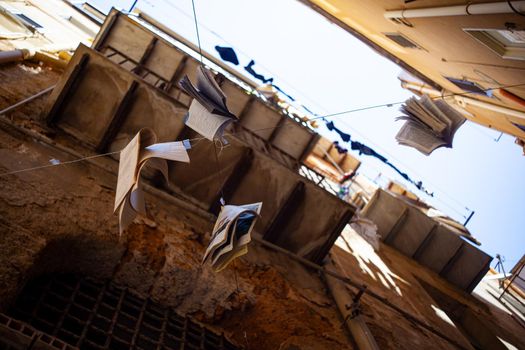 View of various books hanging by the thread