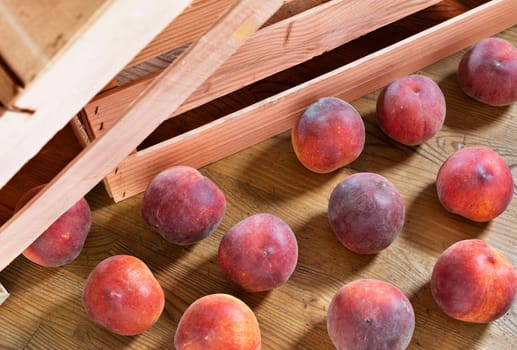 Ripe fruit of peaches  on wooden table ,  healthy eating