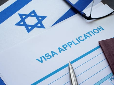 Flag of Israel and visa application form.