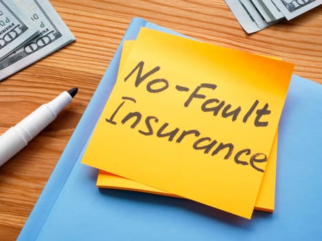 Sticker with memo No fault insurance and notepad.