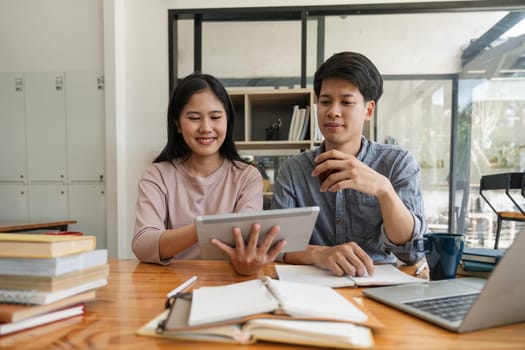 Male and female students reading a book. library research, reading and students with a book, learning knowledge at college. Scholarship, smile at university for education.