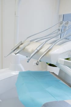 Set of professional equipment in dentist's office. Interior of a dental clinic. Dental office without people. Dentist's instruments, equipment and tools.