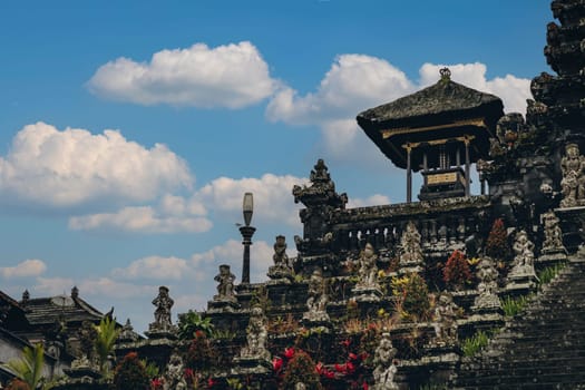 Majestic landscape view of sacred besakih temple with blue cloudy sky. Holy worship cultural attraction in bali