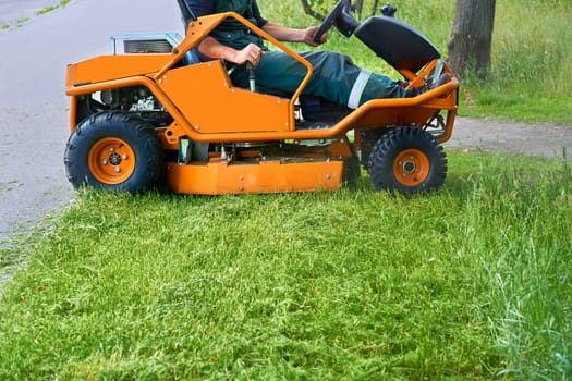 a machine for cutting the grass on a lawn. Professional grass cutting