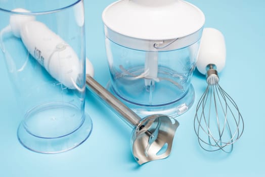 Electric hand mixer. Modern electric kitchen appliances for making sauces, smoothies, puree. Hand mixer set.