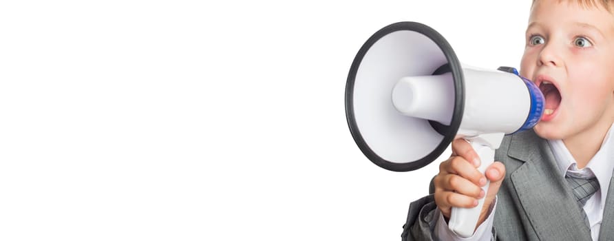 Child businessman holding megaphone. Portrait of a little boy shouting by the megaphone. Child screaming into a megaphone.