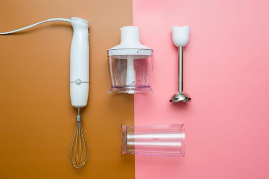 Electric hand mixer. Modern electric kitchen appliances for making sauces, smoothies, puree. Hand mixer set.