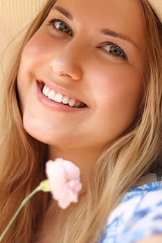 Beauty, summer and skincare, happy smiling woman in hat with flower as cosmetics, wellness and lifestyle fashion portrait