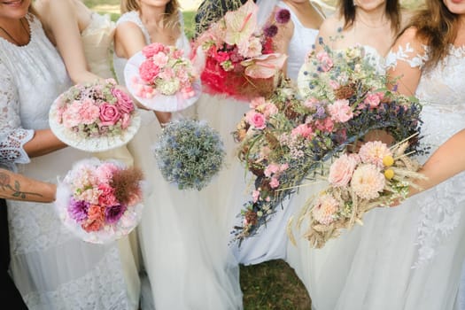 Many brides hold their wedding bouquet in their hands.