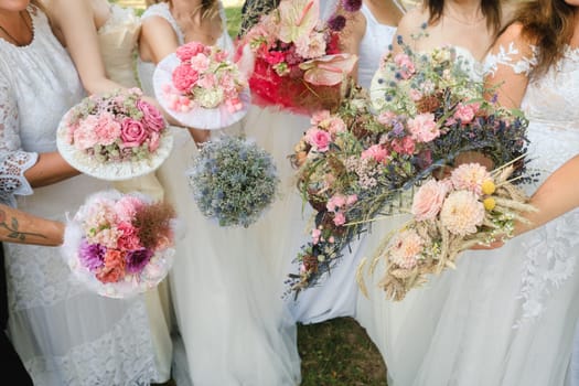 Many brides hold their wedding bouquet in their hands.