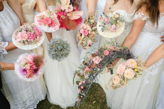 Many brides hold their wedding bouquet in their hands.