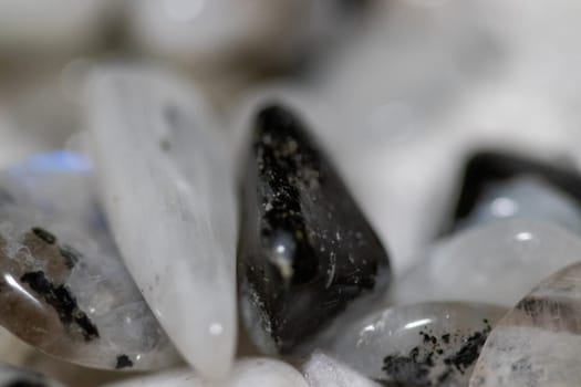 Black and white Moon stones close up view in a pile. High quality photo