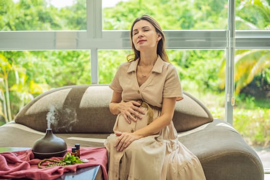 A serene moment captured as a pregnant woman after 40 embraces the soothing benefits of aroma oils and an aroma diffuser, enhancing her pregnancy journey with relaxation and tranquility.