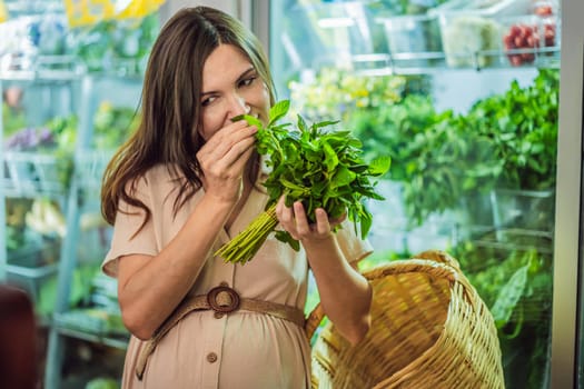 A glowing pregnant woman after forty makes a healthy choice as she selects organic vegetables and fruits at the vibrant organic market, prioritizing her well-being and her baby's health.