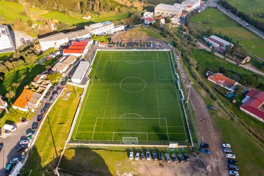 Football field aerial view, public soccer court for training and competition in city.