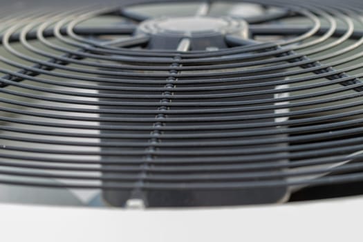 Top angle view of out side air conditioner fan grate. High quality photo