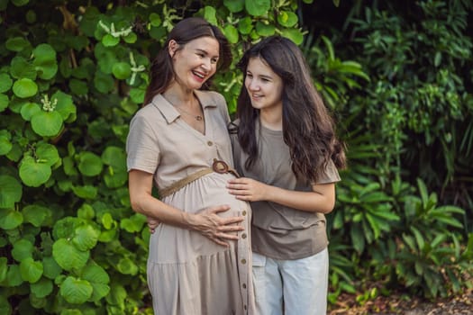 A heartwarming moment captured in the park as a pregnant woman after 40 shares a special bond with her teenage daughter, embracing the beauty of mother-daughter connection.